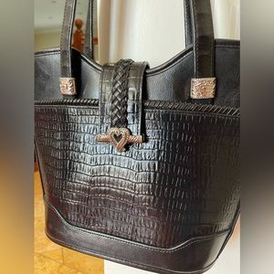 Cute leather bucket bag with silver embellishments. Excellent condition.